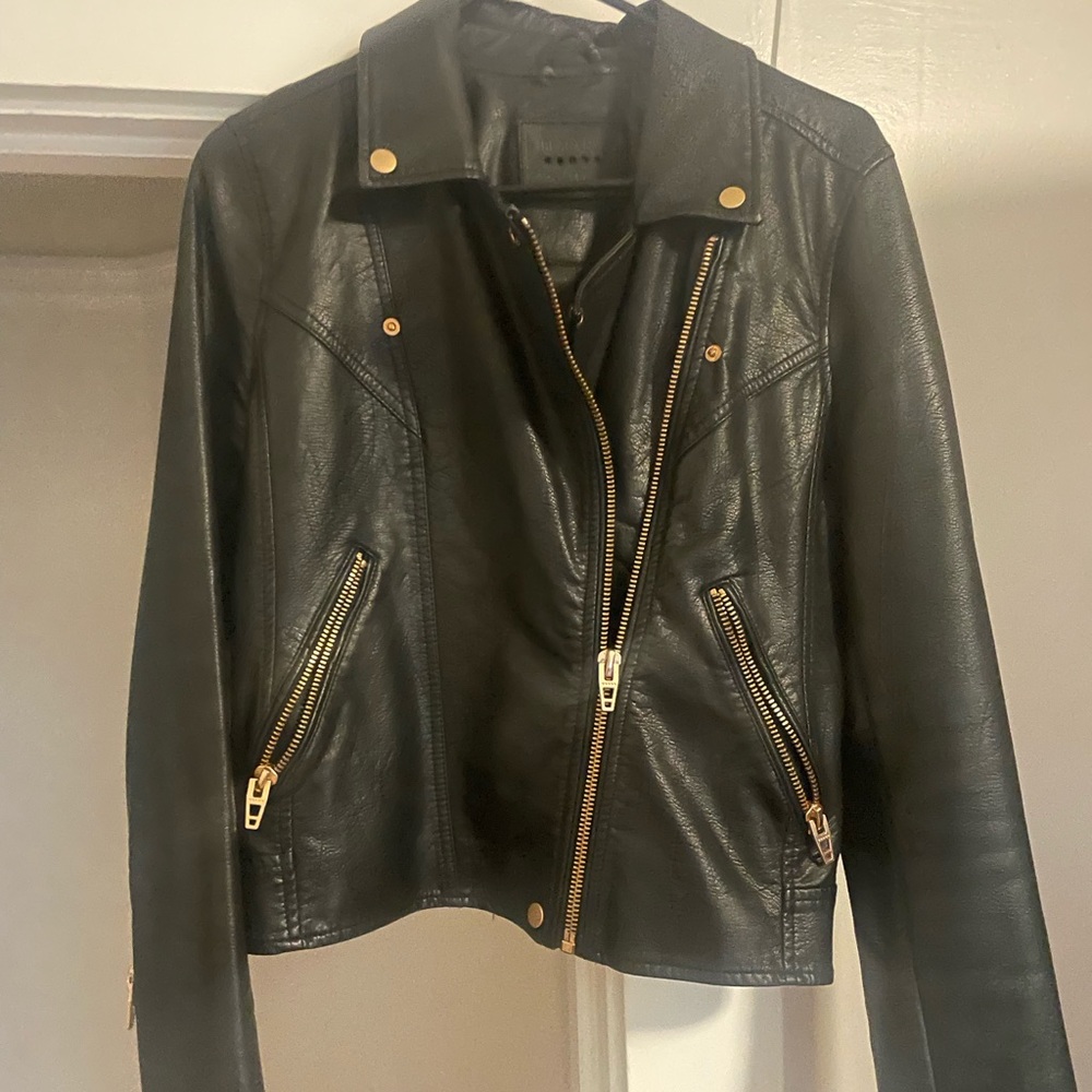 Leather jacket with gold hardware.